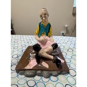 Vintage man sewing fabric with his coffee cup and his mouse ￼